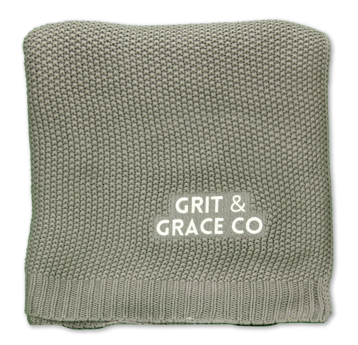 The Aliehs Crochet Knit Throw by Pro Towels is a folded, textured sage green blanket with GRIT & GRACE CO printed in white on its surface.