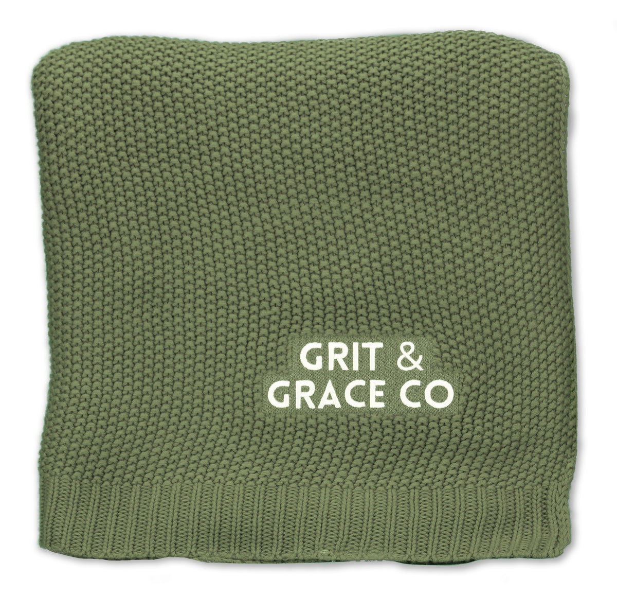 A neatly folded, green Aliehs Crochet Knit Throw by Pro Towels with GRIT & GRACE CO printed in white letters on one side.