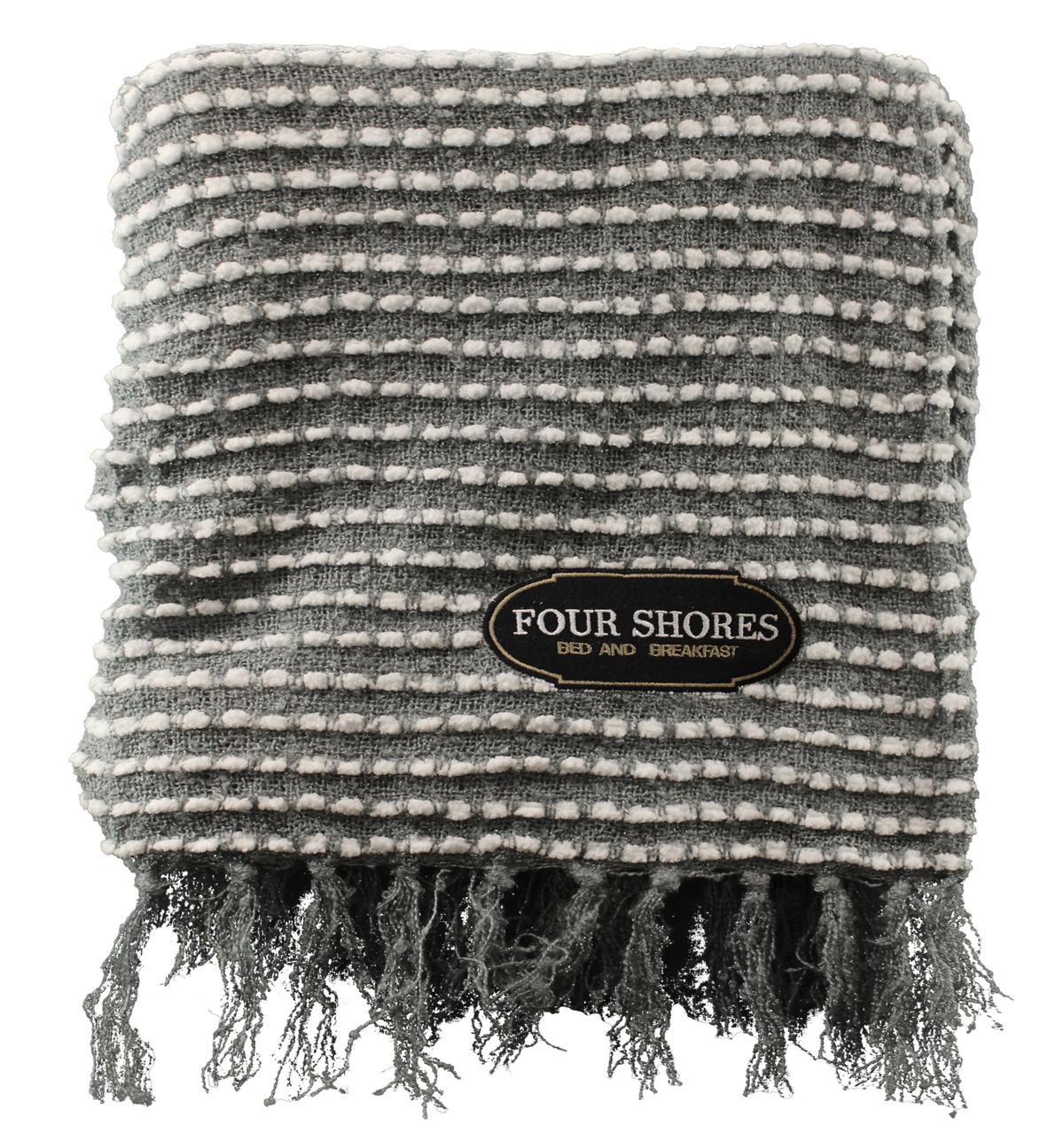 The Charleston Throw by Pro Towels is a folded, textured gray and white blanket with fringe—ideal as a premium blanket for cozy evenings.