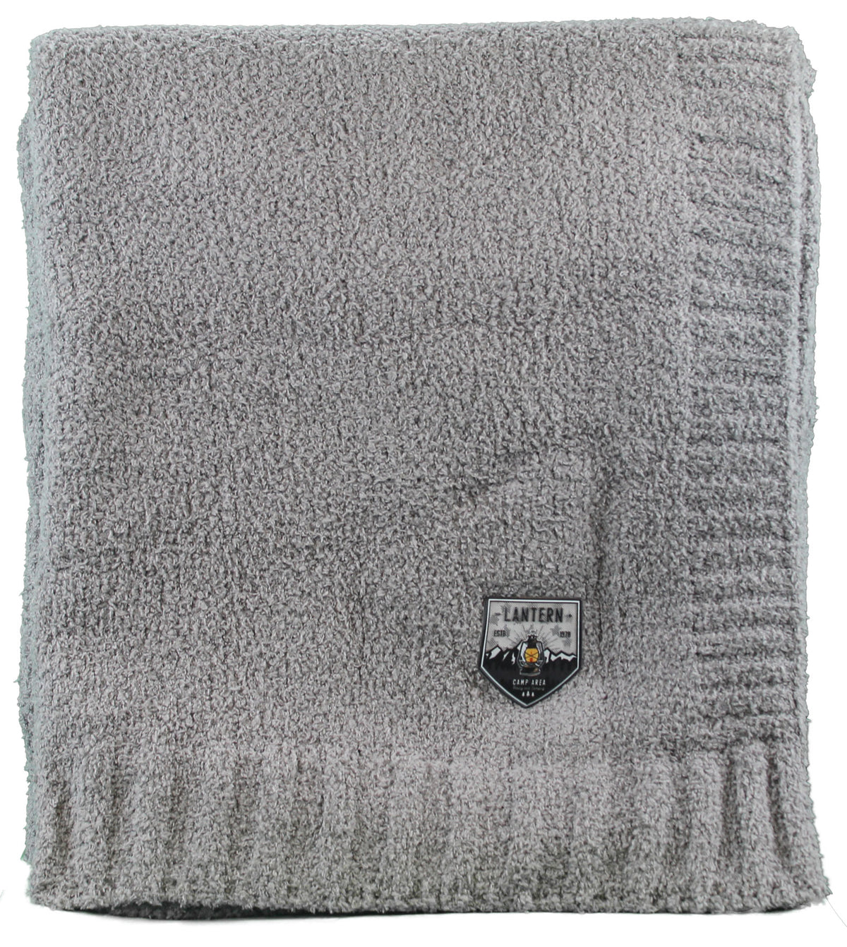 A folded, textured gray Cloud Nine Soft Throw by Pro Towels features a ribbed edge and a small Lantern label—perfect for custom embroidery or bulk wholesale orders.