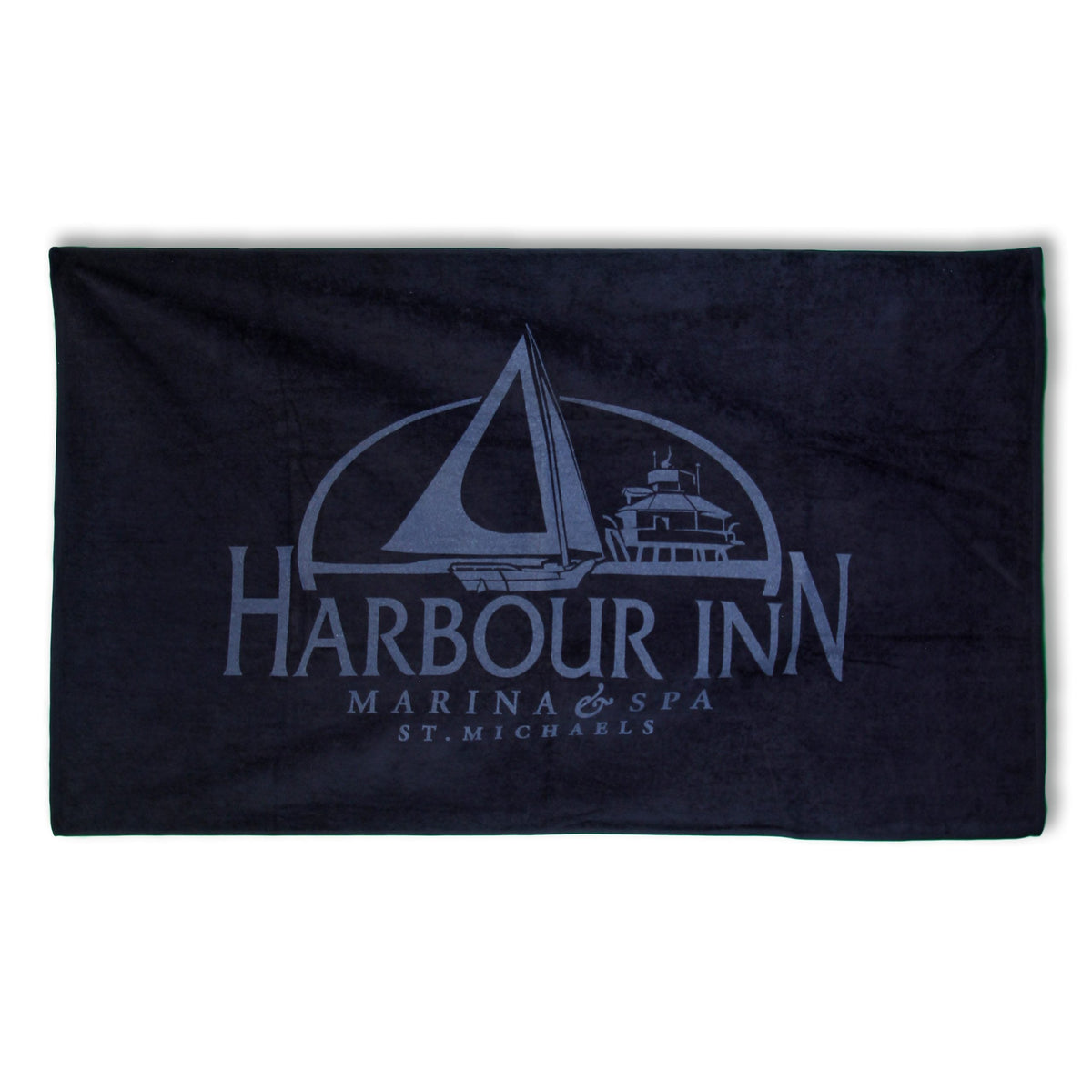 The Pro Towels Colored Beach Towel - Diamond Collection is a dark blue towel featuring a sailboat and yacht graphic with "Harbour Inn Marina & Spa St. Michaels"—ideal for promotions and custom embroidery.