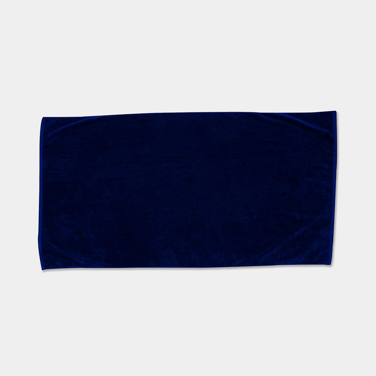The Beach Towel - Jewel Collection by Pro Towels, featuring a rectangular plain dark blue design, is displayed on a light gray background.