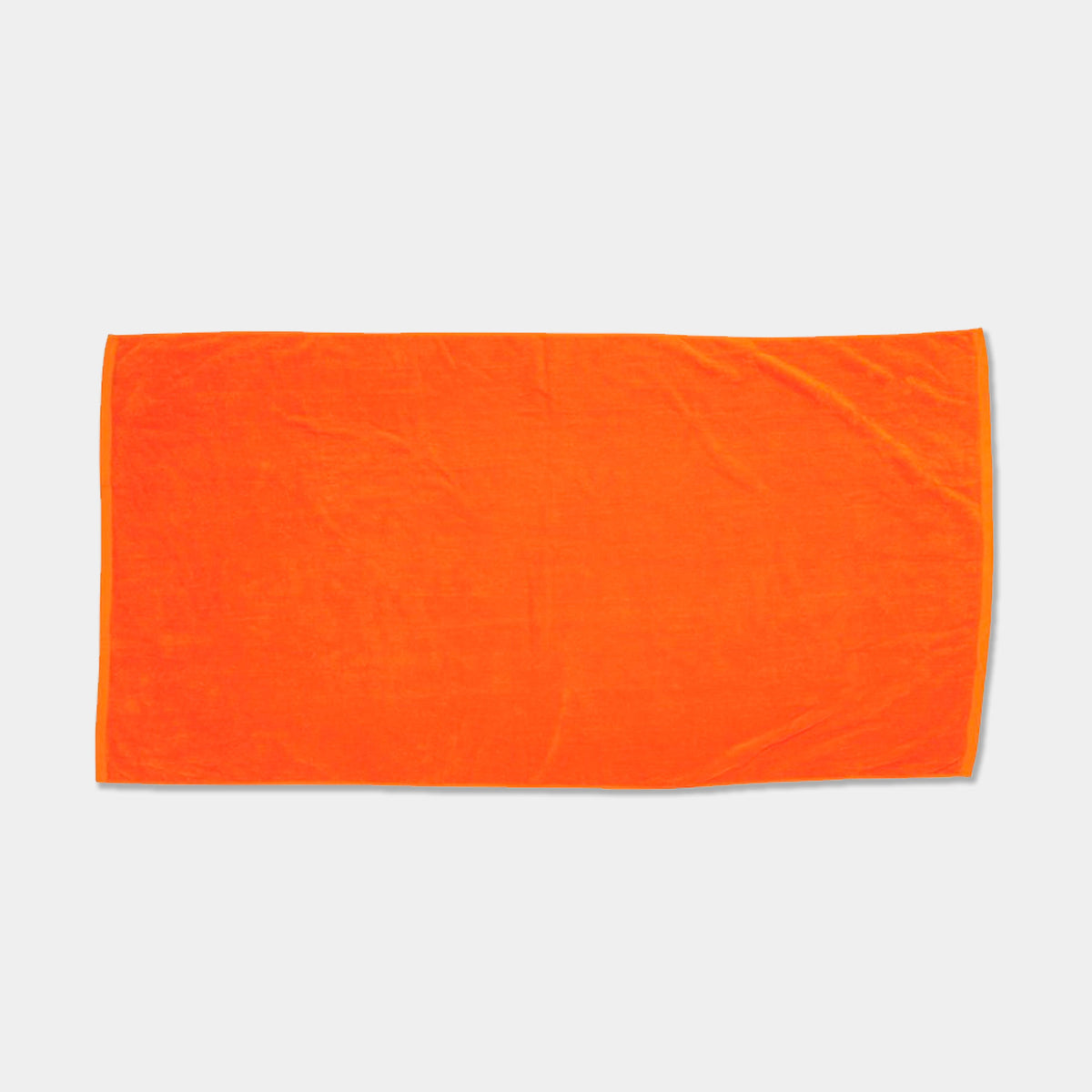 The Beach Towel - Jewel Collection by Pro Towels is shown laid flat on a light gray background. Its rectangular, bright orange design is ideal for custom embroidery or wholesale orders.