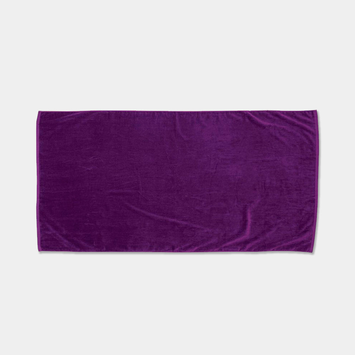 The Beach Towel - Jewel Collection by Pro Towels is a rectangular, plush purple towel displayed on a light gray background—ideal for wholesale orders or custom embroidery.