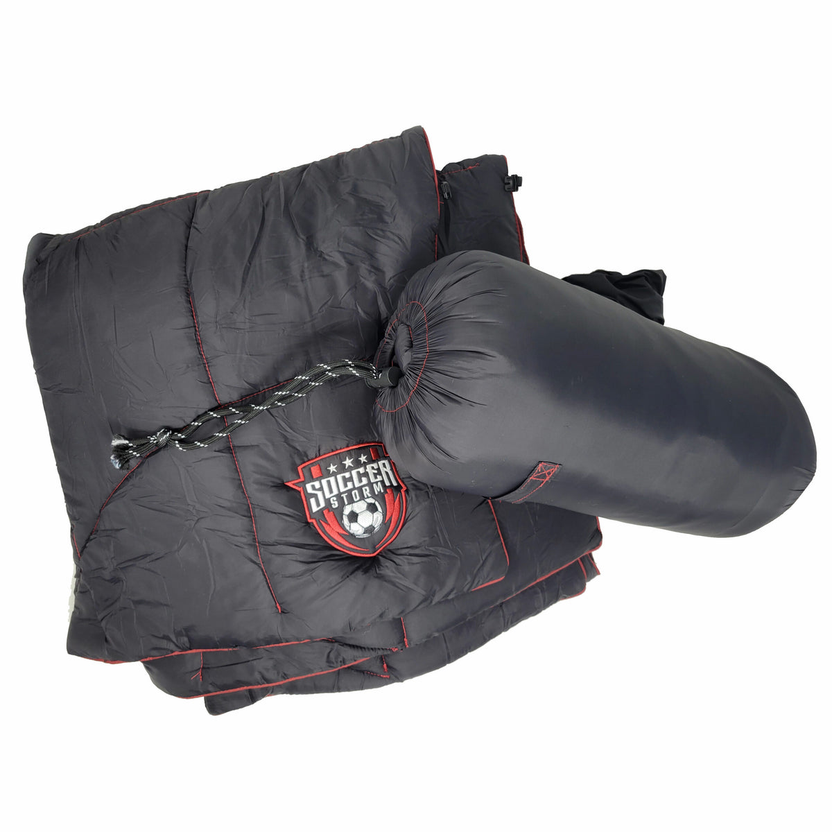 The Lofthouse Camping Blanket by Pro Towels is a dark gray, weather-resistant sleeping bag with red stitching, shown partially folded beside its cylindrical carry bag. It features a Soccer Today logo with a soccer ball and stars.