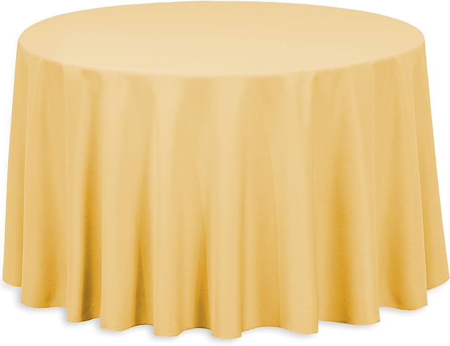 A round table is covered with the Ganesh Mills Oxford Round Table Linen - Multicolor, its fabric draping evenly over the sides for a smooth, softly folded look.