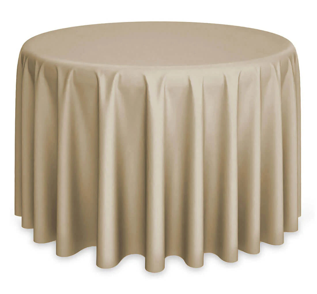 A round table is draped to the floor with the Ganesh Mills Oxford Round Table Linen - Multicolor, creating gentle, even folds around the edges.