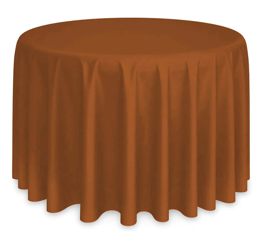 A round table draped with the Ganesh Mills Oxford Round Table Linen - Multicolor, featuring soft, even folds on all sides. Set against a plain white background, it’s ideal for showcasing round or wholesale table linens.