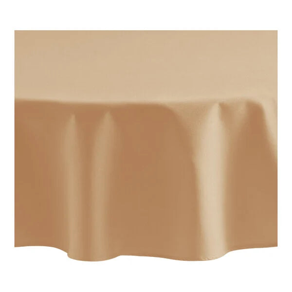 A close-up of a round table covered with a Ganesh Mills Oxford Round Table Linen - Multicolor, draping smoothly and evenly over the edges.