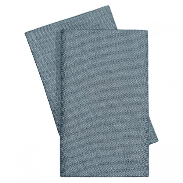 Two neatly folded KSE Operating Room Towels are stacked on a plain white background, highlighting their clean, textured finish.