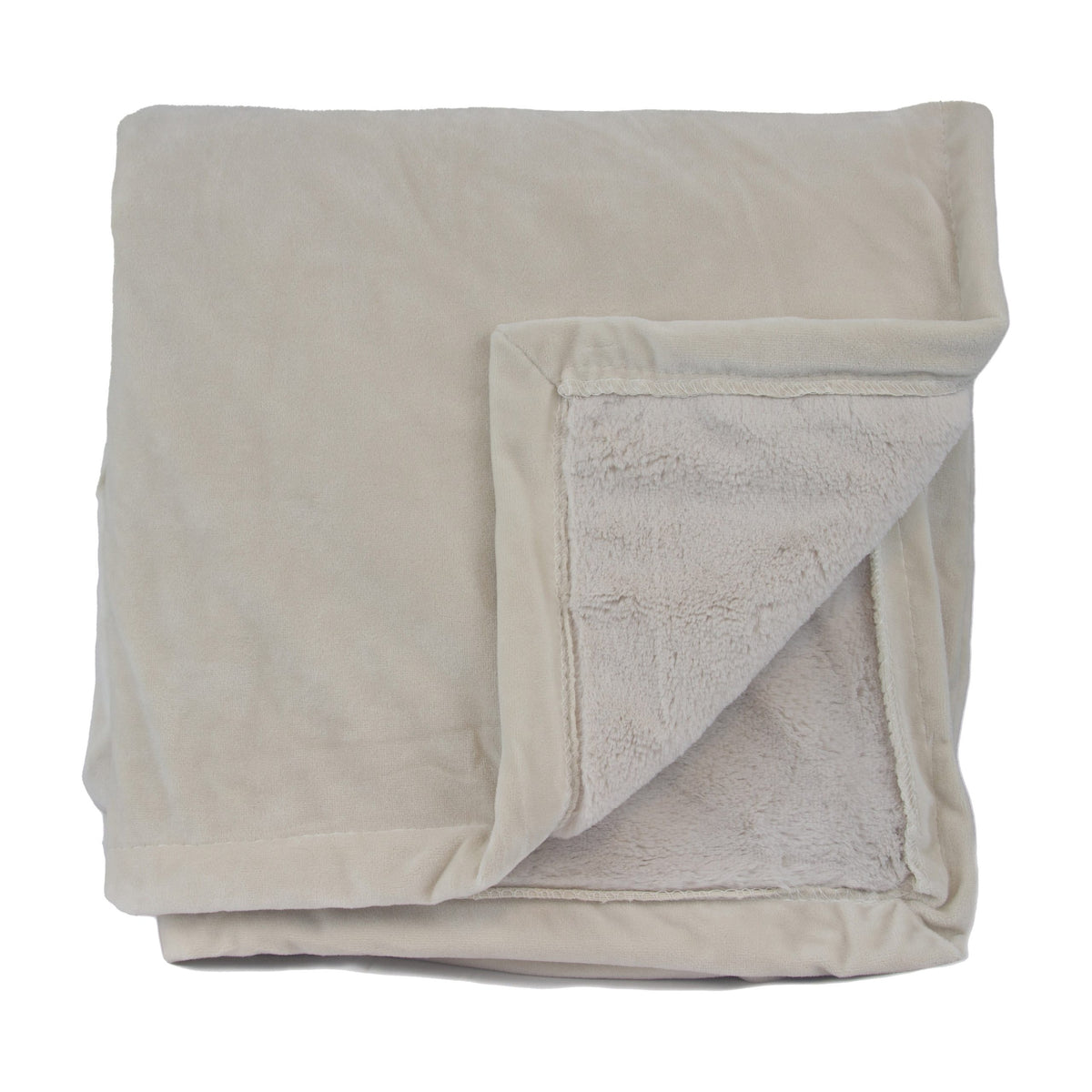 A folded beige Pro Towels Opulence Throw shows its soft, plush underside where one corner is turned over.