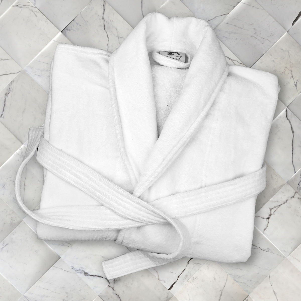 A White Replacement Belt for Oxford Velour Bathrobes by Ganesh Mills is folded and placed on a light marble-patterned tiled surface.