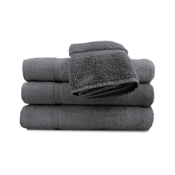 A neatly folded stack of three Ganesh Mills Hand Towel - Oxford Imperiale Color Towels in dark gray, topped with a matching ringspun cotton hand towel, set against a white background.