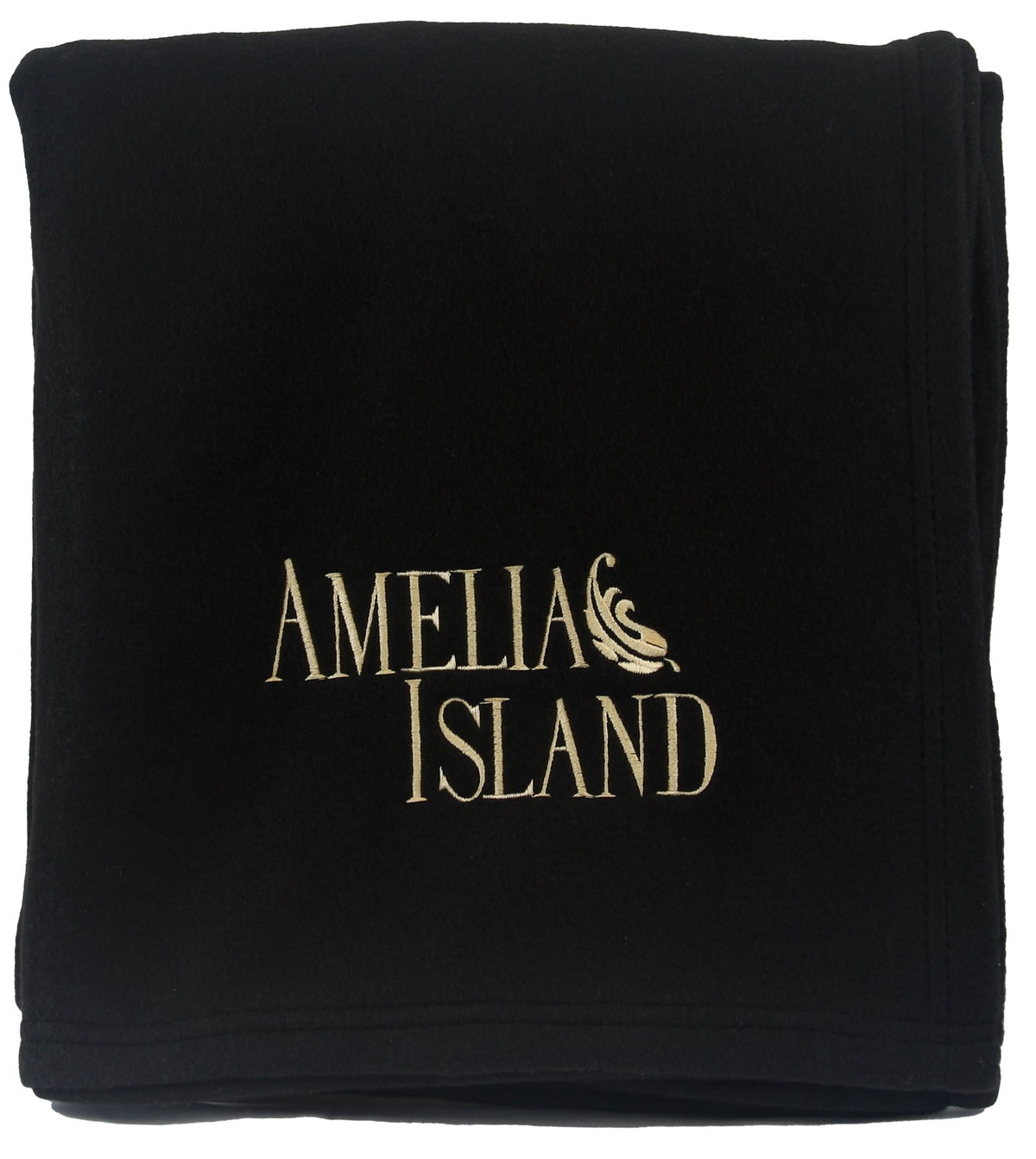 A folded black Pro Towels Promo Fleece Blanket featuring Amelia Island embroidered in beige thread with a decorative swirl above the I in Island.