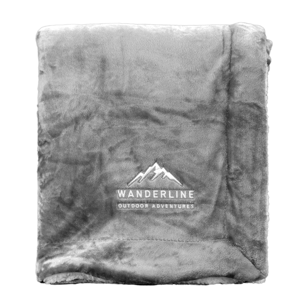 A folded grey Pro Towels Palmetto Challenger Blanket fleece with a mountain logo and “WANDERLINE OUTDOOR ADVENTURES” custom embroidered on one corner.
