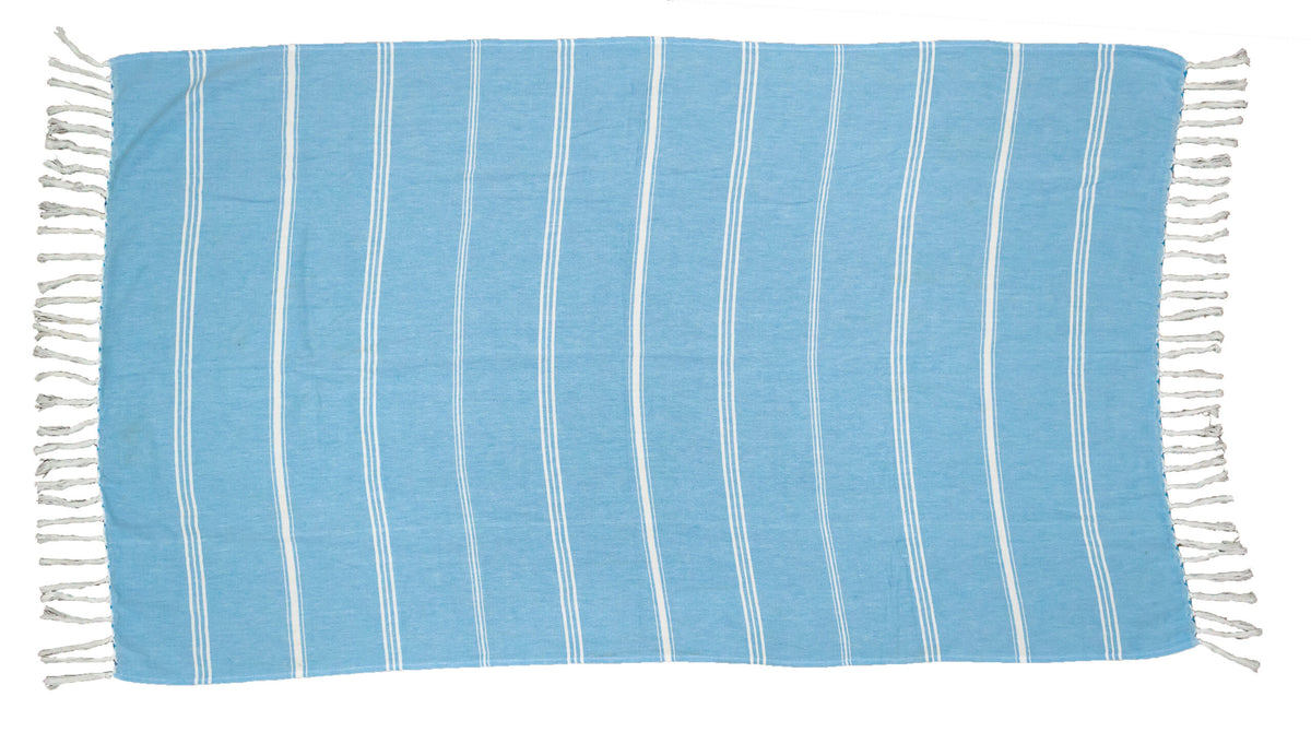 The Pro Towels Peshtemal Beach Towel features a rectangular light blue design with thin white vertical stripes and white fringe tassels on the short edges, crafted from soft Turkish cotton and displayed flat on a white background.