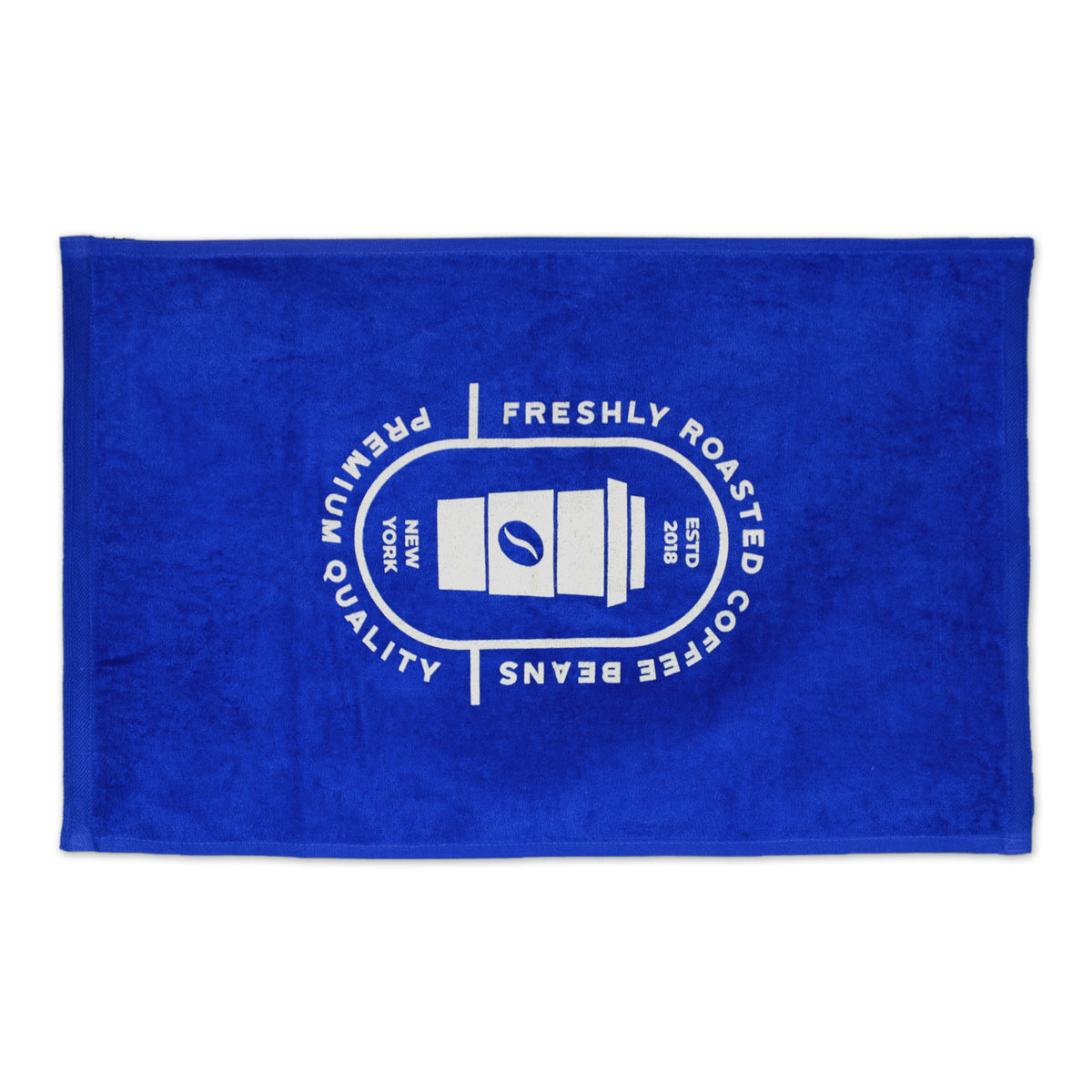 The Pro Towels Platinum Collection Golf Towel with Corner Grommet features a royal blue color and a white circular logo with a coffee cup and the words Freshly Roasted Coffee Beans, Altitudinous, Premium, and New York—perfect for company promotions or custom embroidery.