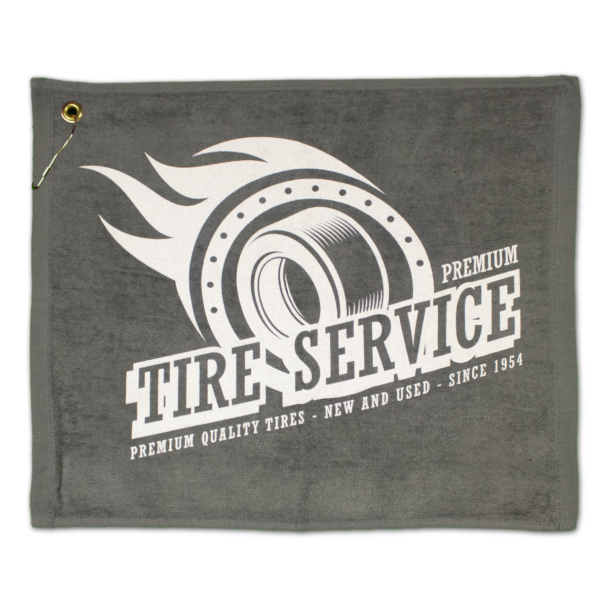 The Pro Towels Jewel Collection Soft Touch Golf Towel in gray features a metal corner grommet, a flaming tire graphic, and "Premium Tire Service: Premium quality tires—new and used—since 1954.