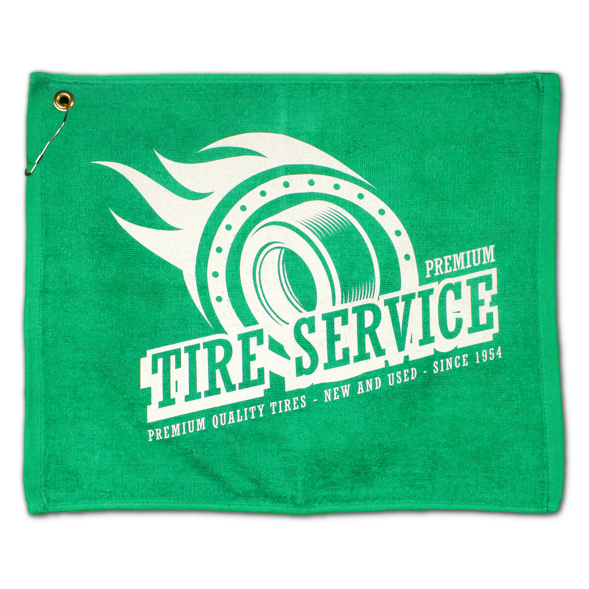 The Jewel Collection Soft Touch Golf Towel by Pro Towels is green, features a tire-with-flames design with “Premium Tire Service. Premium Quality Tires – New and Used – Since 1954,” and includes a metal grommet and hook in the upper left corner.