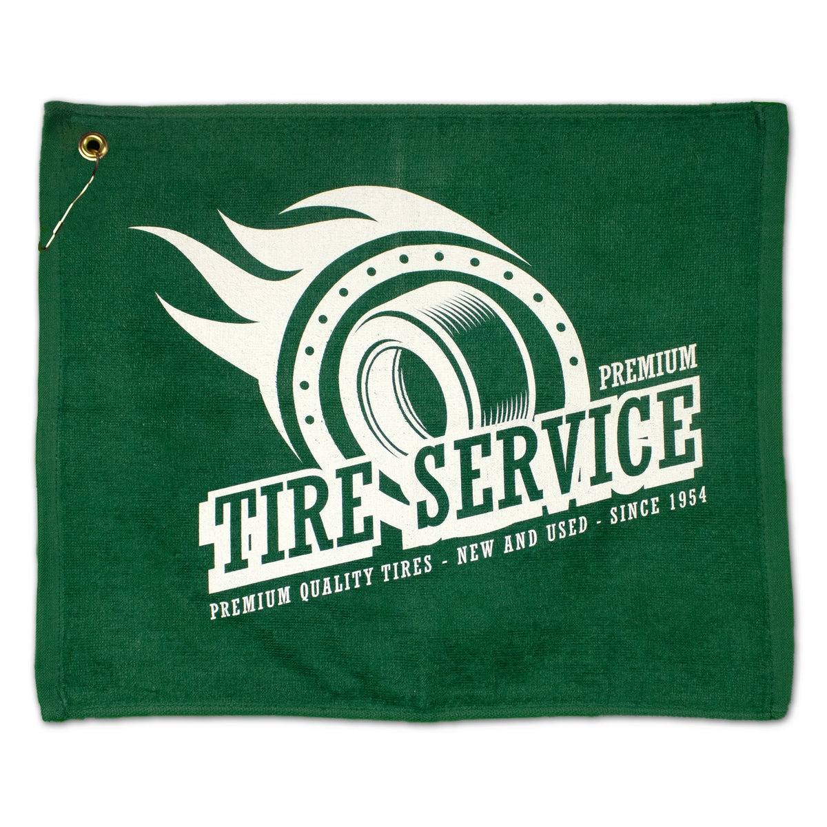 The Pro Towels Jewel Collection Soft Touch Golf Towel is green and features a flaming tire graphic with "TIRE SERVICE PREMIUM" text, plus "Premium Quality Tires – New and Used – Since 1954." Includes a metal grommet in the upper left corner.