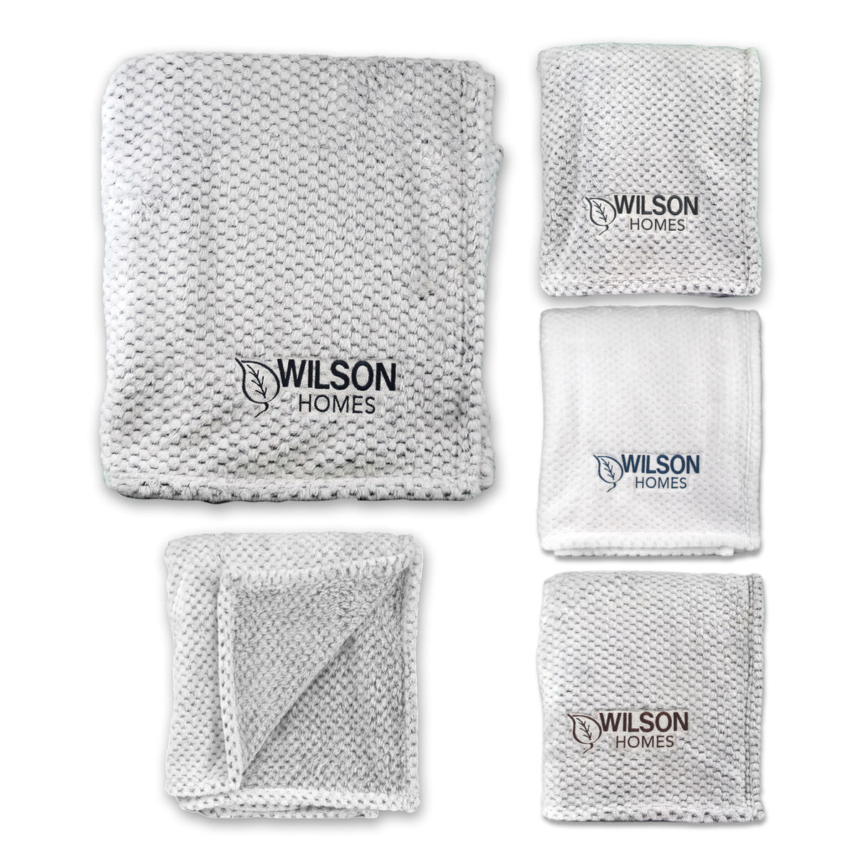 Five views of a white Wanderlust Blanket by Pro Towels, featuring plush textured fabric and custom embroidery. Shown folded and unfolded, its perfect for everyday use or as a bulk wholesale travel blanket option.