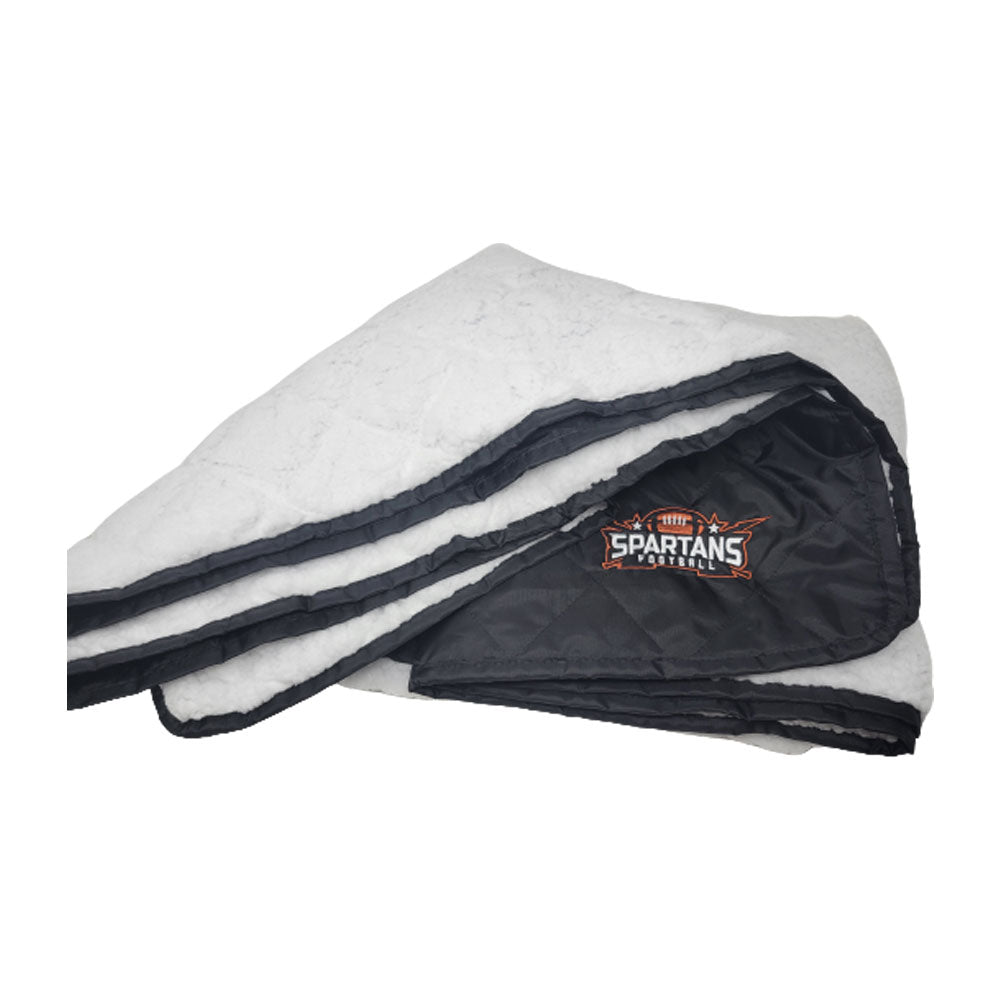 The Pro Towels Waterproof Sherpa Blanket features a soft, plush interior and a black side with custom Spartans Football logo embroidery—ideal as an outdoor blanket for chilly game days.