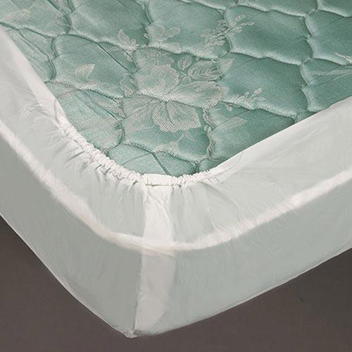 Close-up of a green floral mattress corner protected by the Bargoose AllergyCare Cotton Fitted Mattress Encasement (16 Deep), featuring an elastic edge for a secure, snug fit.