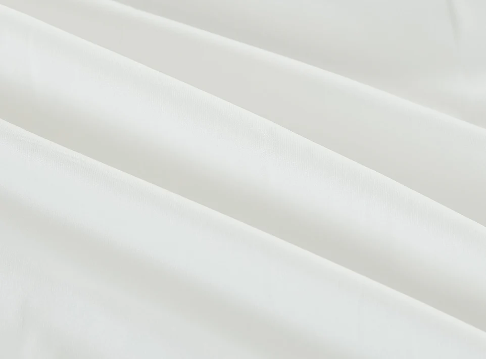 The Bargoose BedBug Solution™ Elite Zippered Duvet Cover features smooth, white fabric with soft folds and shadows for a clean, elegant look while protecting your bedding.