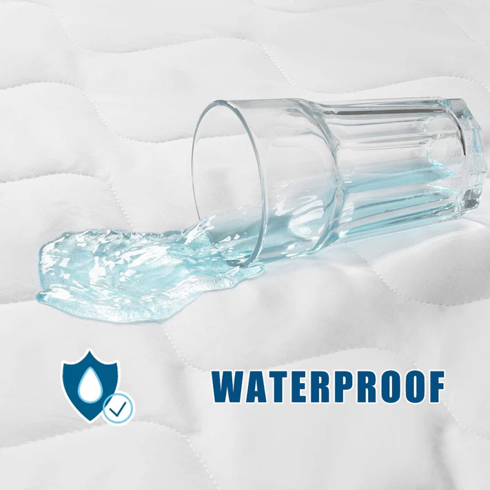 Water beads up on the Bargoose Deluxe Microfiber Waterproof Quilted Mattress Pad with a 16" fitted skirt, proving its effective protection. A shield icon with a droplet and checkmark highlights its waterproof performance.