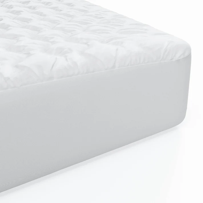 Close-up of the Bargoose Deluxe Microfiber Waterproof Quilted Mattress Pad with a 16" fitted skirt, featuring a quilted, textured top and smooth sides, shown on a white surface.