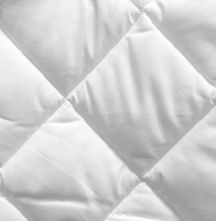 Close-up of the 1Concier Mat Pad Super Basic Mattress Pad with 7.50 oz fill, featuring a white quilted diamond pattern and soft, padded texture for enhanced guest comfort.