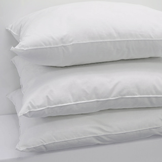 Three clean, white Pillow Softique - 1Concier pillows by 1Concier are stacked neatly against a plain white background, featuring T-180 ticking and super slick cluster fibers for luxurious comfort.