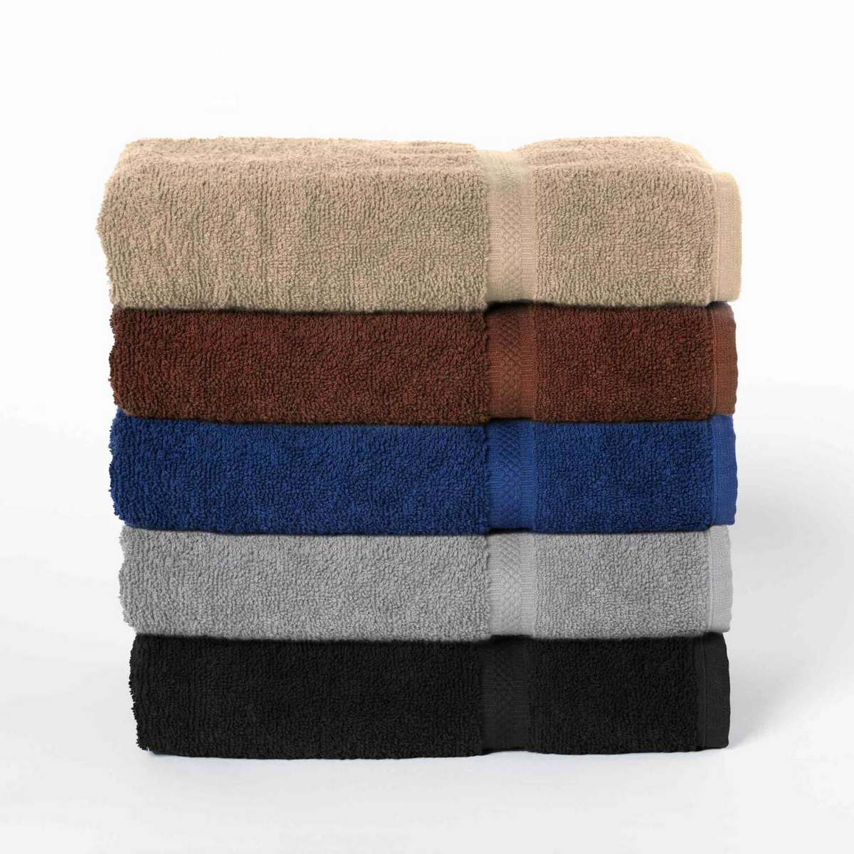 A stack of six WestPoint Home Martex Colors Dobby Towels in beige, brown, blue, gray, and black rests against a white background. These bleach-friendly towels combine durability with vibrant style.