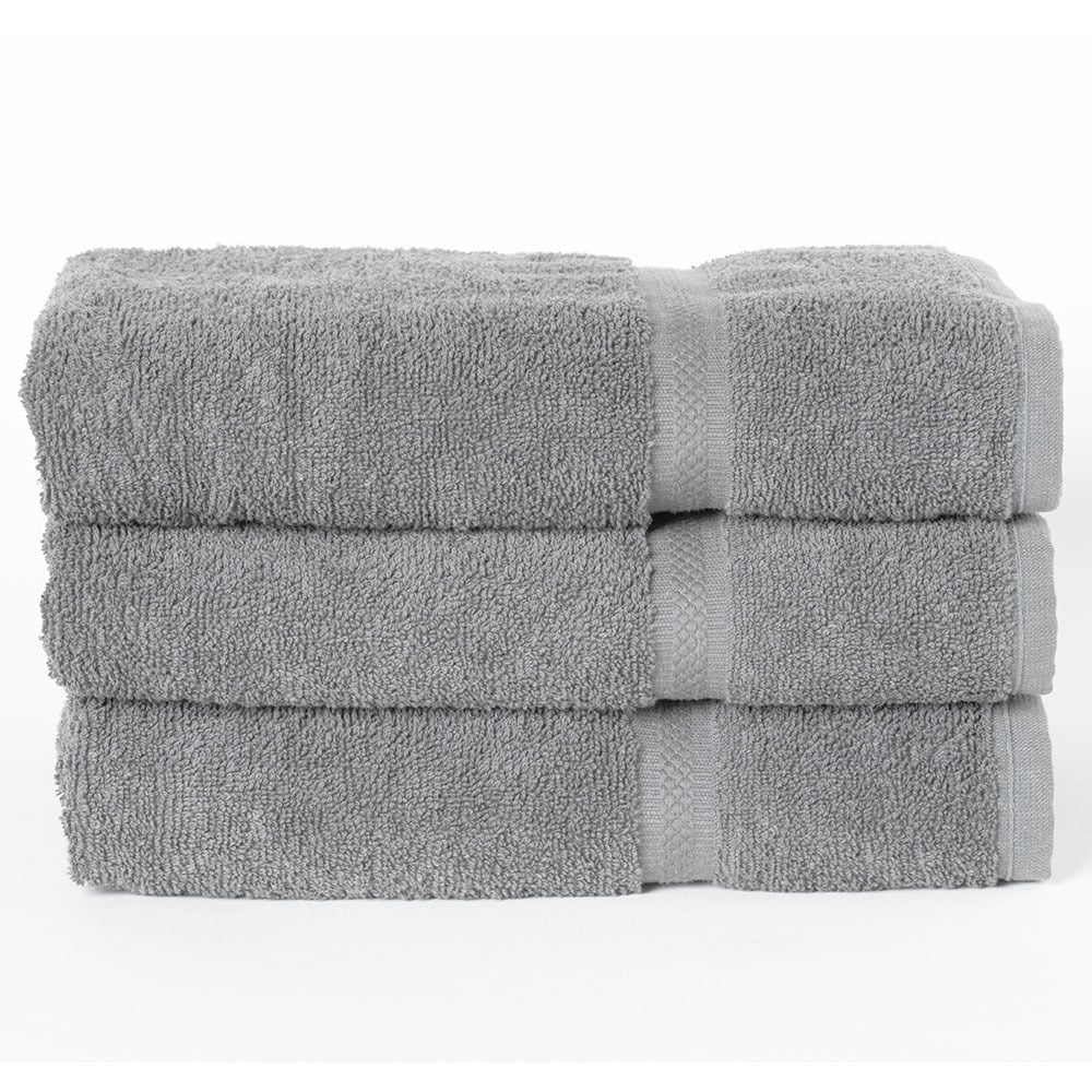 Three neatly folded WestPoint Home Dobby Towels from the Martex Colors collection, made of bleach-friendly ringspun cotton, are stacked atop each other against a plain white background.