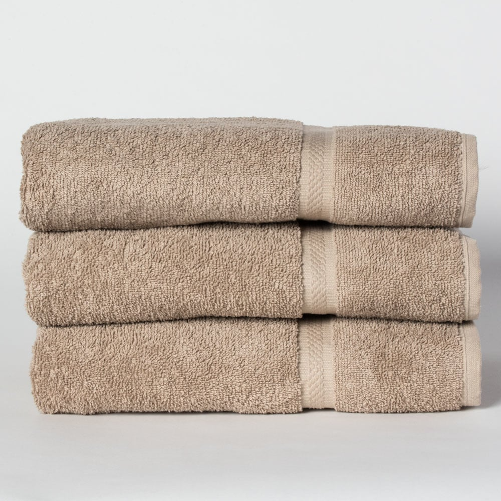 Three neatly folded Dobby Towel - Martex Colors by WestPoint Home are stacked atop each other against a plain white background.