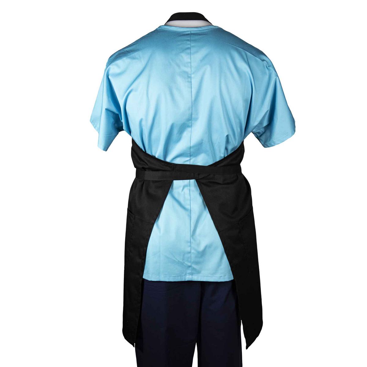 A person wearing a light blue short-sleeve shirt, dark pants, and a WestPoint Home Martex Health Lab Coat, tied at the waist, stands with their back to the camera.