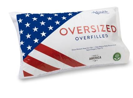 The A+ Pillows Jumbo Pillow Oversized & Overstuffed features a white design with an American flag on the left and "OVERSIZED OVERFILLED" on the right, offering extra support with eco-friendly, made-in-America labels.