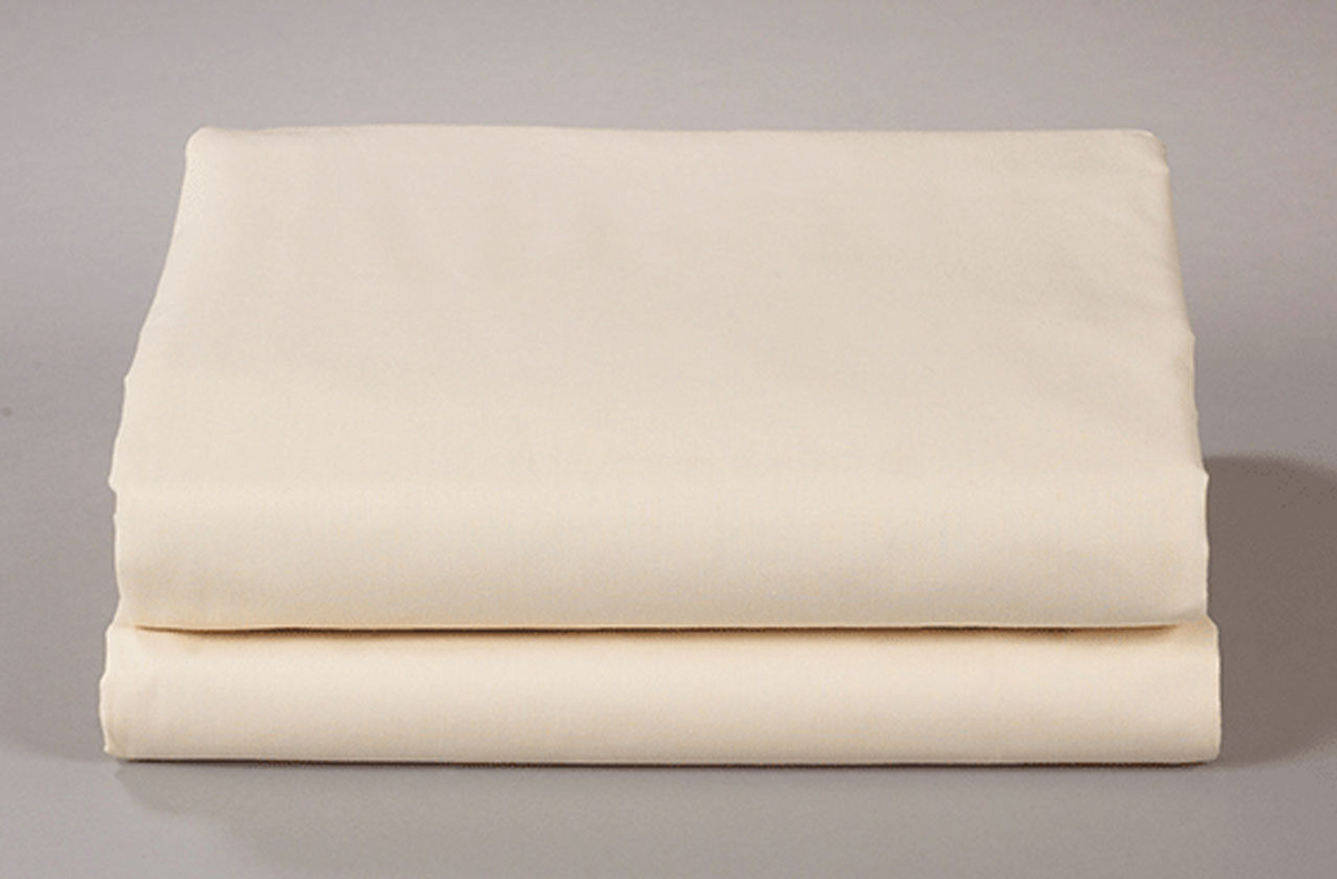 Two cream-colored Thomaston Mills Flat Sheets – 250 Thread Count are neatly folded and stacked against a plain, light grey background.
