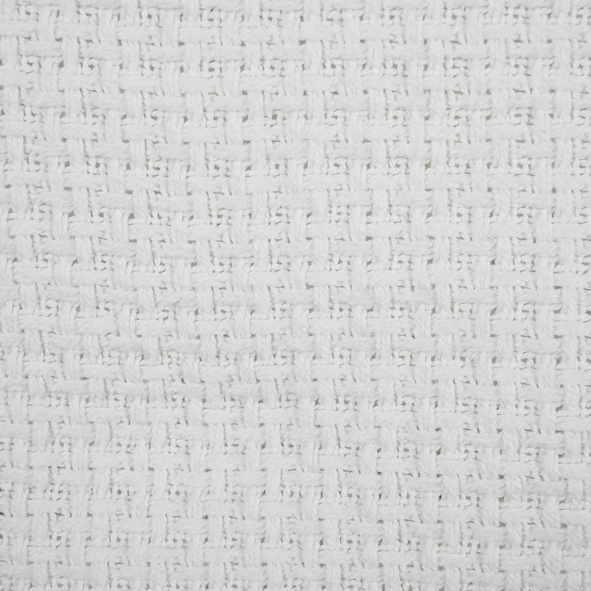 Close-up of the FiveStar Basketweave - Cotton Blanket by WestPoint Home, featuring a soft white cotton surface with a textured, grid-like pattern from interlaced threads and a consistent, uniform design throughout.