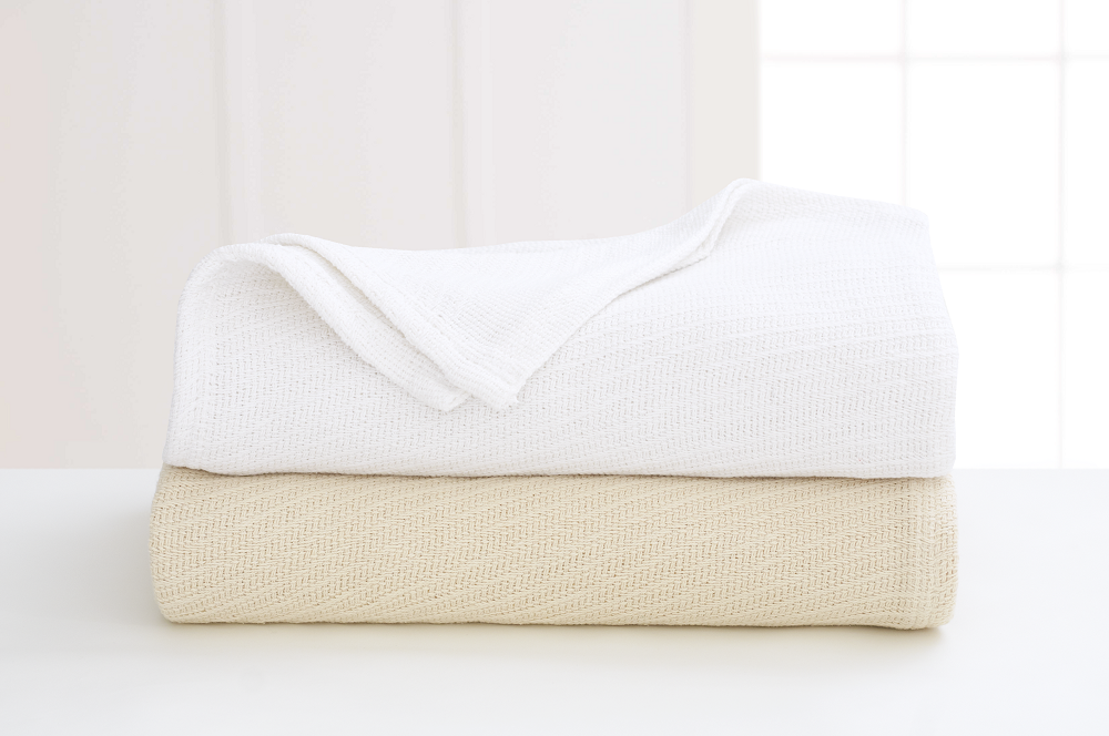 The Grand Patrician Cotton Blanket by WestPoint Home is ideal for hotels or anyone needing bulk wholesale blankets.