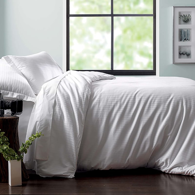 The Martex Green Collection Duvet Cover by WestPoint Home features soft, 250-thread-count white bedding made from OEKO-TEX certified, sustainable cotton for a comfortable and eco-friendly sleep.
