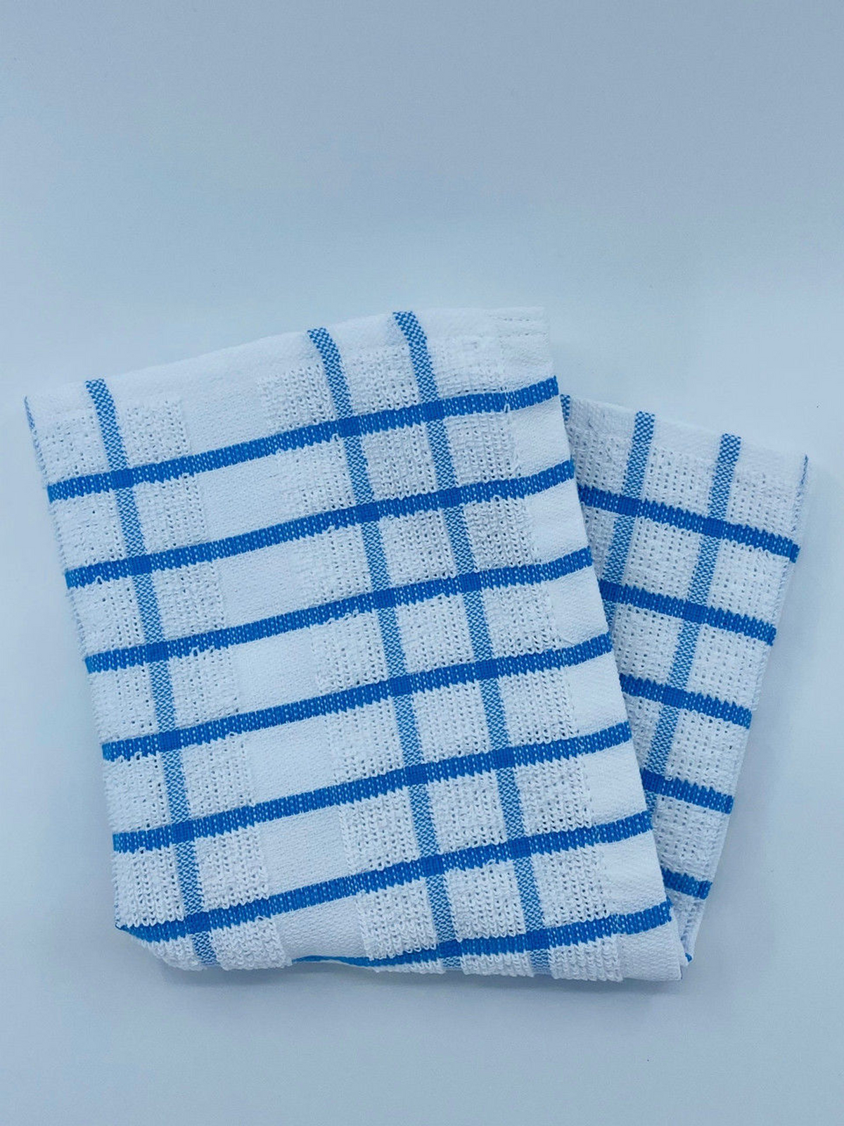 The Ganesh Mills Pot Holder from the Colored/Checkered Pattern Oxford Kitchen Ensemble is neatly folded on a plain white background, making it an ideal kitchen essential.