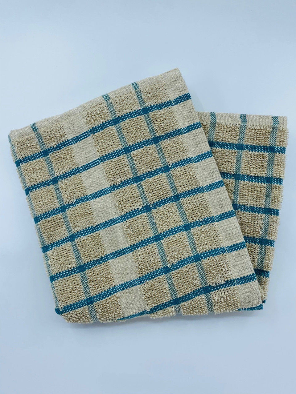 The Ganesh Mills Pot Holder from the Oxford Kitchen Ensemble features a beige, textured surface with blue and brown checkered patterns, displayed on a plain white background.