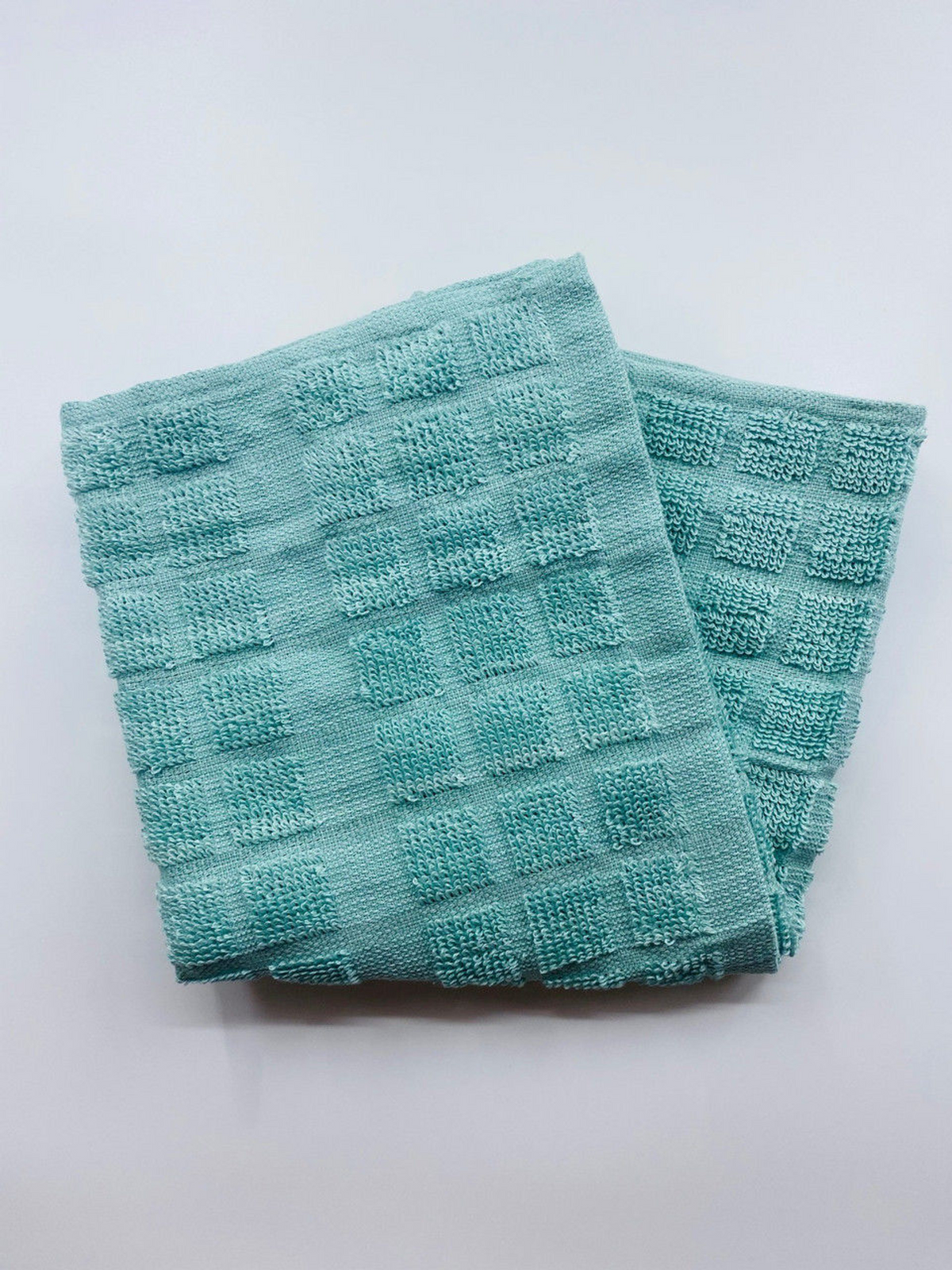 The Ganesh Mills Pot Holder from the Colored/Checkered Pattern Oxford Kitchen Ensemble, ideal for kitchen use, is displayed on a plain white surface.