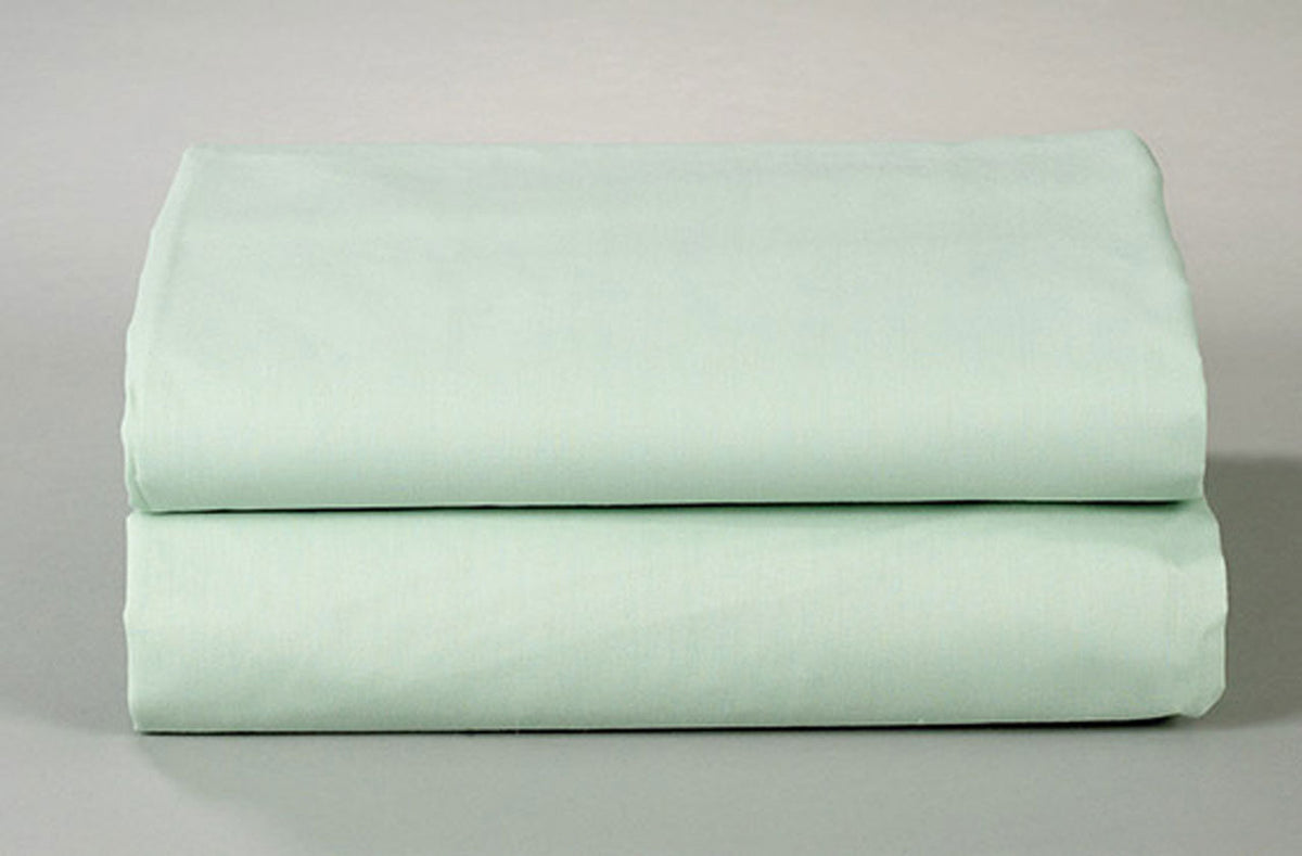 A neatly folded light green Thomaston Mills Pillowcase - Single Pick Percale, ideal for commercial laundry, is displayed on a plain light gray surface.