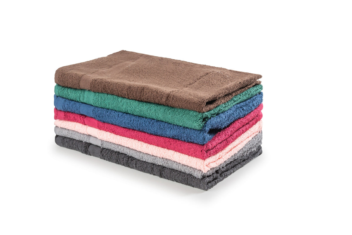 A neatly folded stack of ten single-color KSE wash cloths, available in brown, green, blue, red, pink, and gray, placed on a white background. Perfect for anyone needing bulk wholesale towels for any setting.