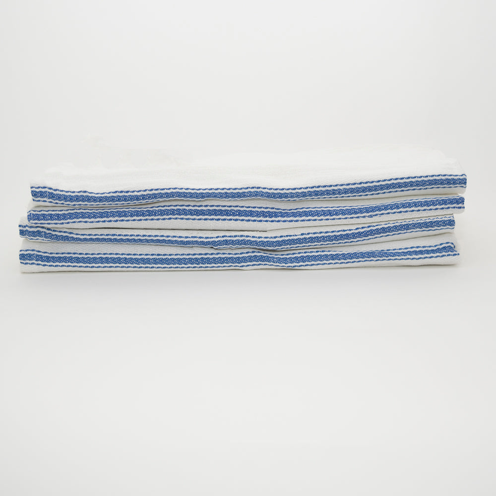 Three folded Calderon Textiles kitchen towels, white with blue stripes and a herringbone weave, are stacked neatly against a plain white background.