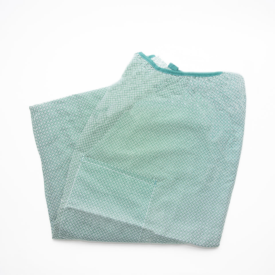 The IV Bariatric Patient Gown by Calderon Textiles features a subtle green and white pattern and is shown folded on a white background.