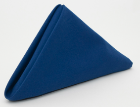 The Calderon Textiles Prisma Napkin, featuring stain resistance and Color Lock dyeing technology in dark blue, is neatly folded into a triangle and set on a plain white surface.
