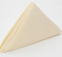 The Prisma Napkin by Calderon Textiles is neatly folded in a triangular shape against a white background, highlighting its beige color, durability, and stain resistance.